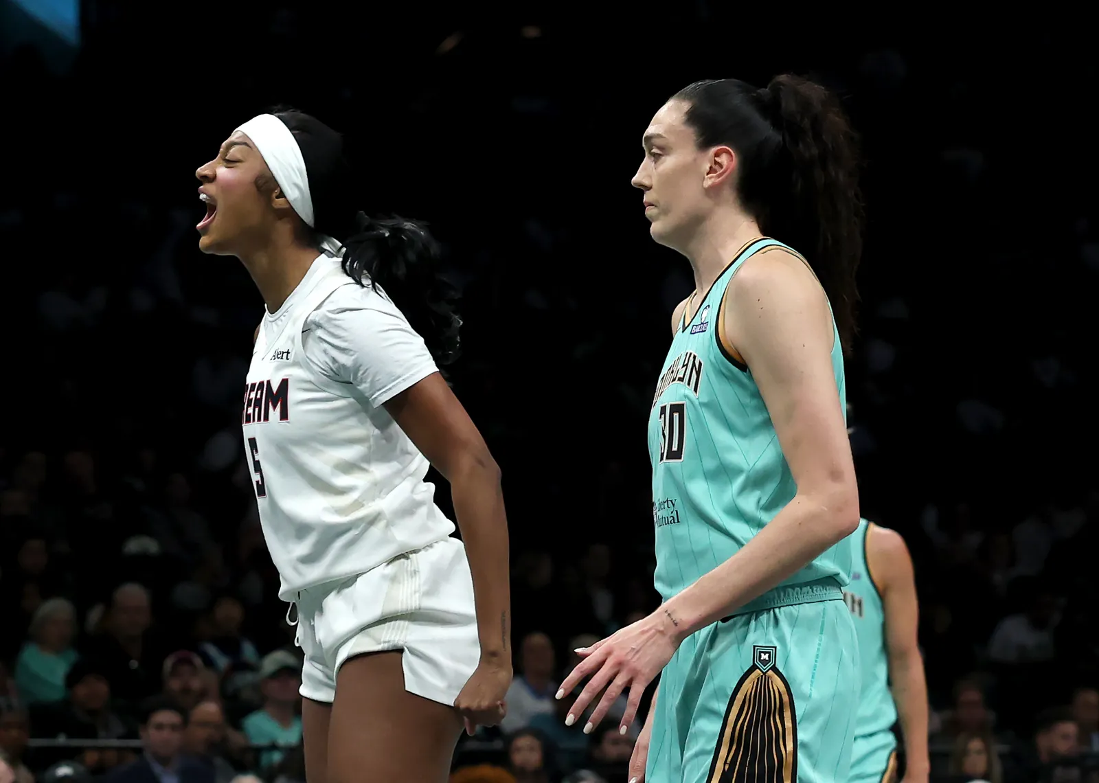 Dream star Angel Reese reacts during game against Liberty as Breanna Stewart looks on