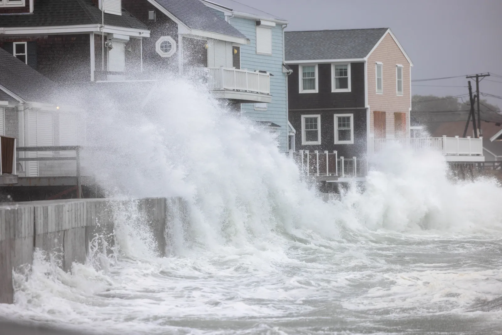 Waves crash over homes on Rebecca Road during a nor'easter on September 26, 2026 in Scituate, Massachusetts.