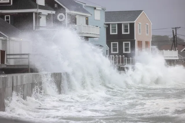 Waves crash over homes on Rebecca Road during a nor'easter on September 26, 2026 in Scituate, Massachusetts.