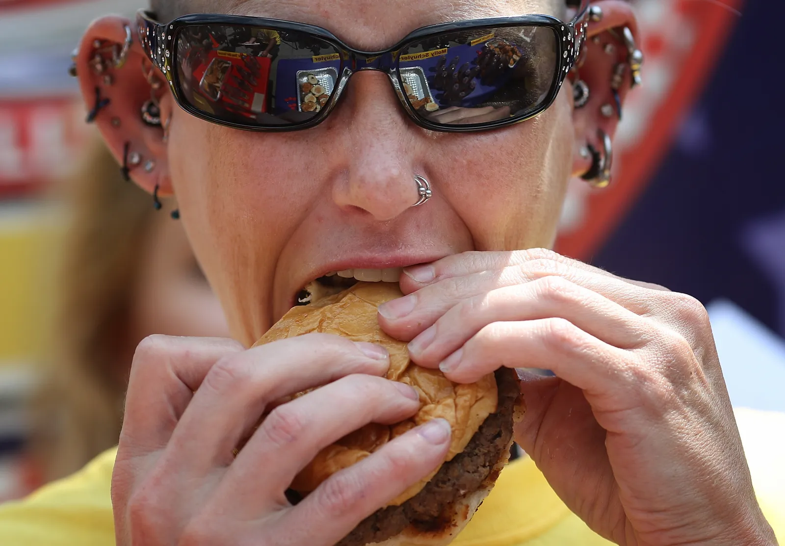 Molly Schuyler, the #1 ranked competitive eater in the world, downs a burger in the 9th Annual Independence Burger Eating Championship at Z-Burger on July 3, 20