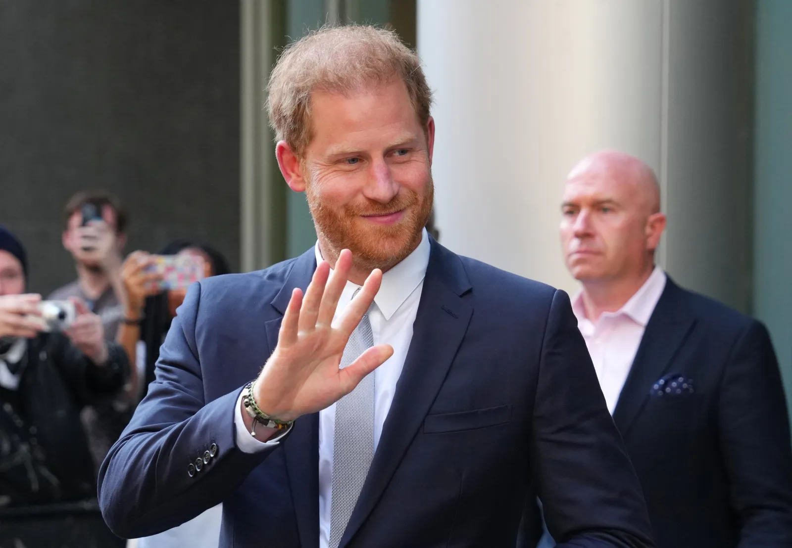 Prince Harry, the Duke of Sussex, waves as he leaves the Rolls Building at High Court after giving evidence at the Mirror Group phone-hacking trial related to a