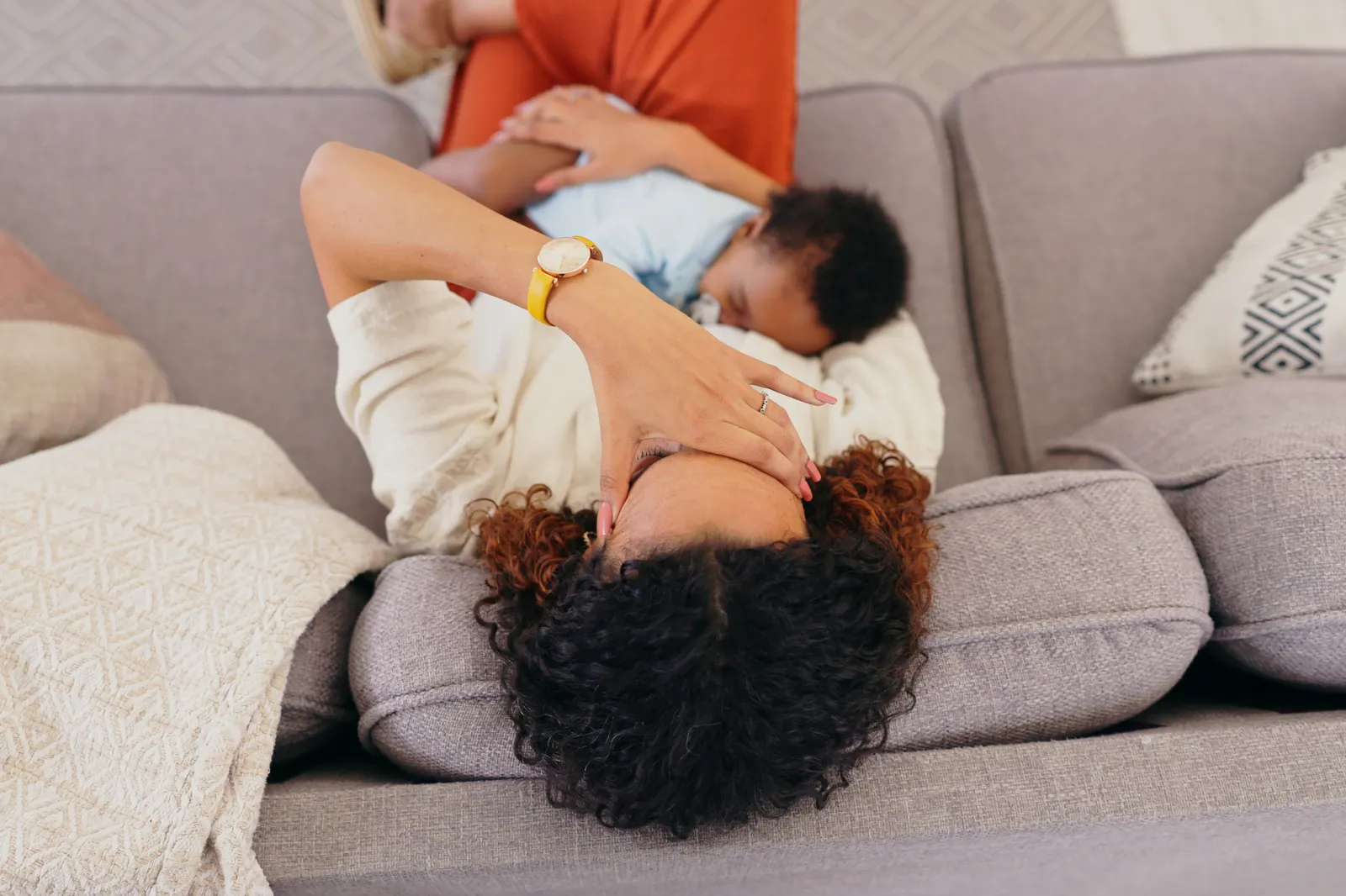 Stock photo: A new mother holding her baby in her arms.