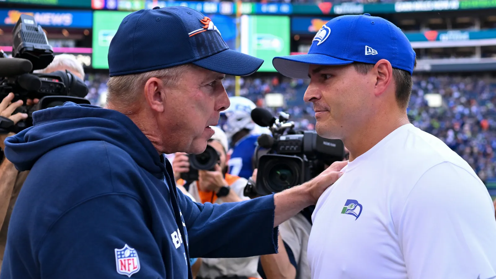 Head coach Sean Payton of the Denver Broncos and head coach Mike Macdonald of the Seattle Seahawks meet after the game at Lumen Field on September 08, 2024 in Seattle, Washington. The Seahawks defeated the Broncos 26-20. (Photo by Alika Jenner/Getty Images)