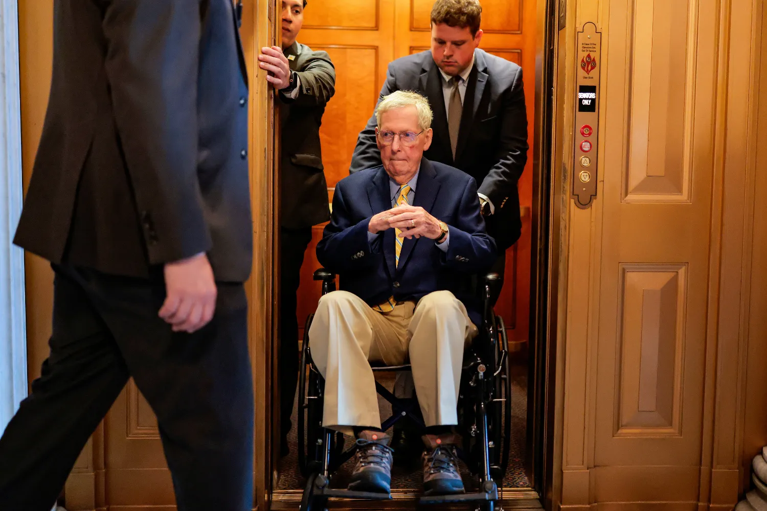 U.S. Sen. Mitch McConnell (R-KY) is pushed in a wheelchair during a vote at the U.S. Capitol Building on April 13, 2026.