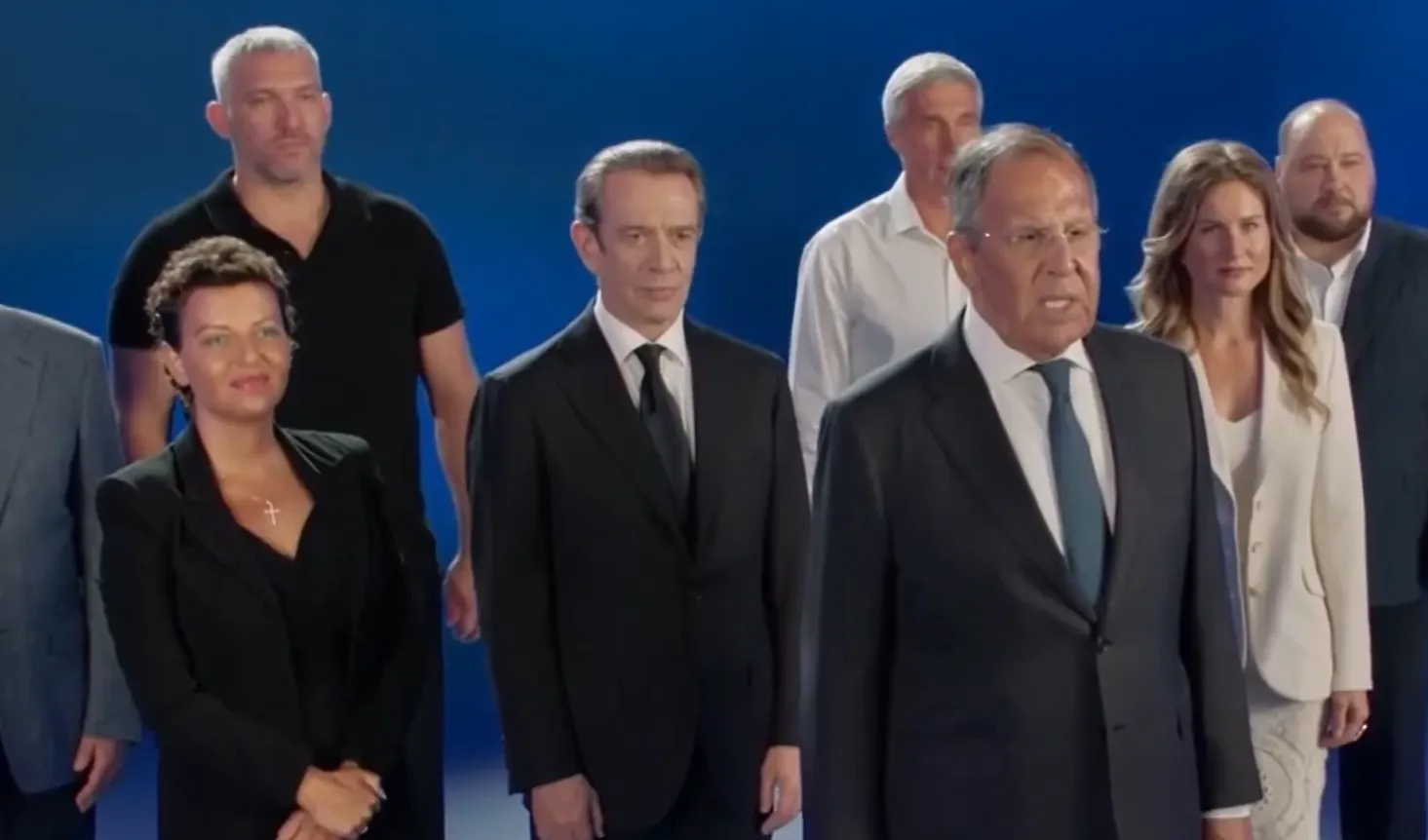 Ovechkin, seen left in a black polo, stands behind Foreign Minister Sergei Lavrov, front, in a campaign advert for the United Russia party.