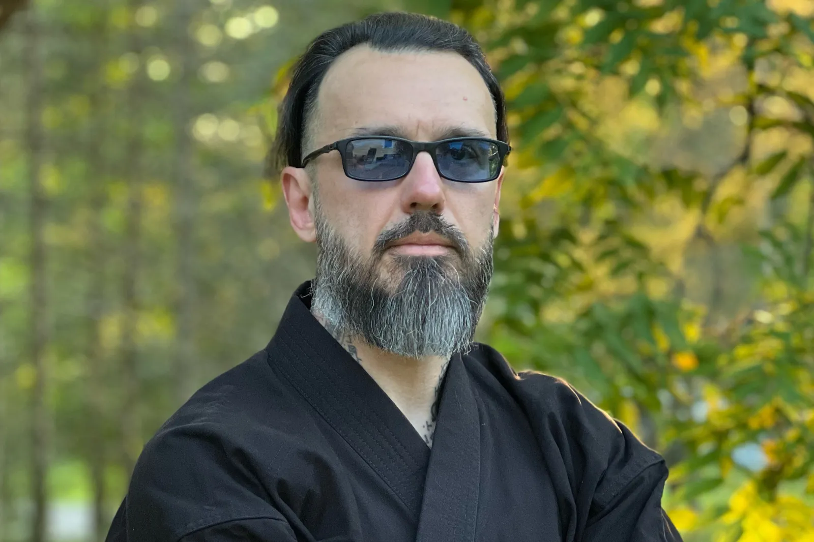 Damien Echols is seen in sunglasses recently in a wooded setting.
