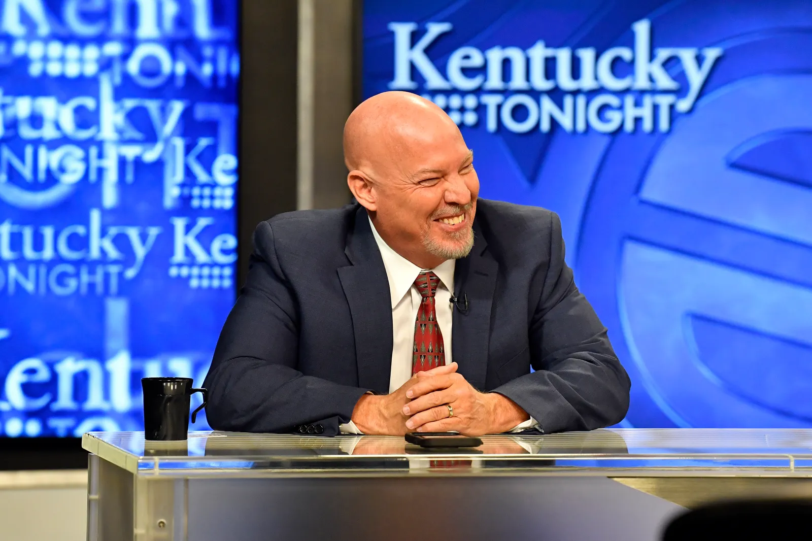 Kentucky gubernatorial candidate Eric Deters smiles at a comment before the start of the Kentucky Gubernatorial GOP Primary Debate in Lexington, Ky., Monday, May 1, 2023. (AP Photo/Timothy D. Easley)