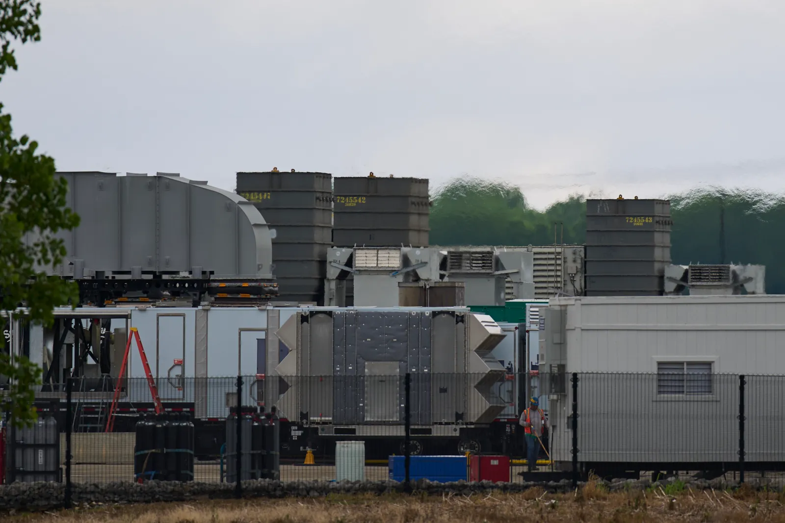 Gas turbines are seen outside the xAI data center on May 7, 2025, in Memphis, Tennessee. (AP Photo/George Walker IV)