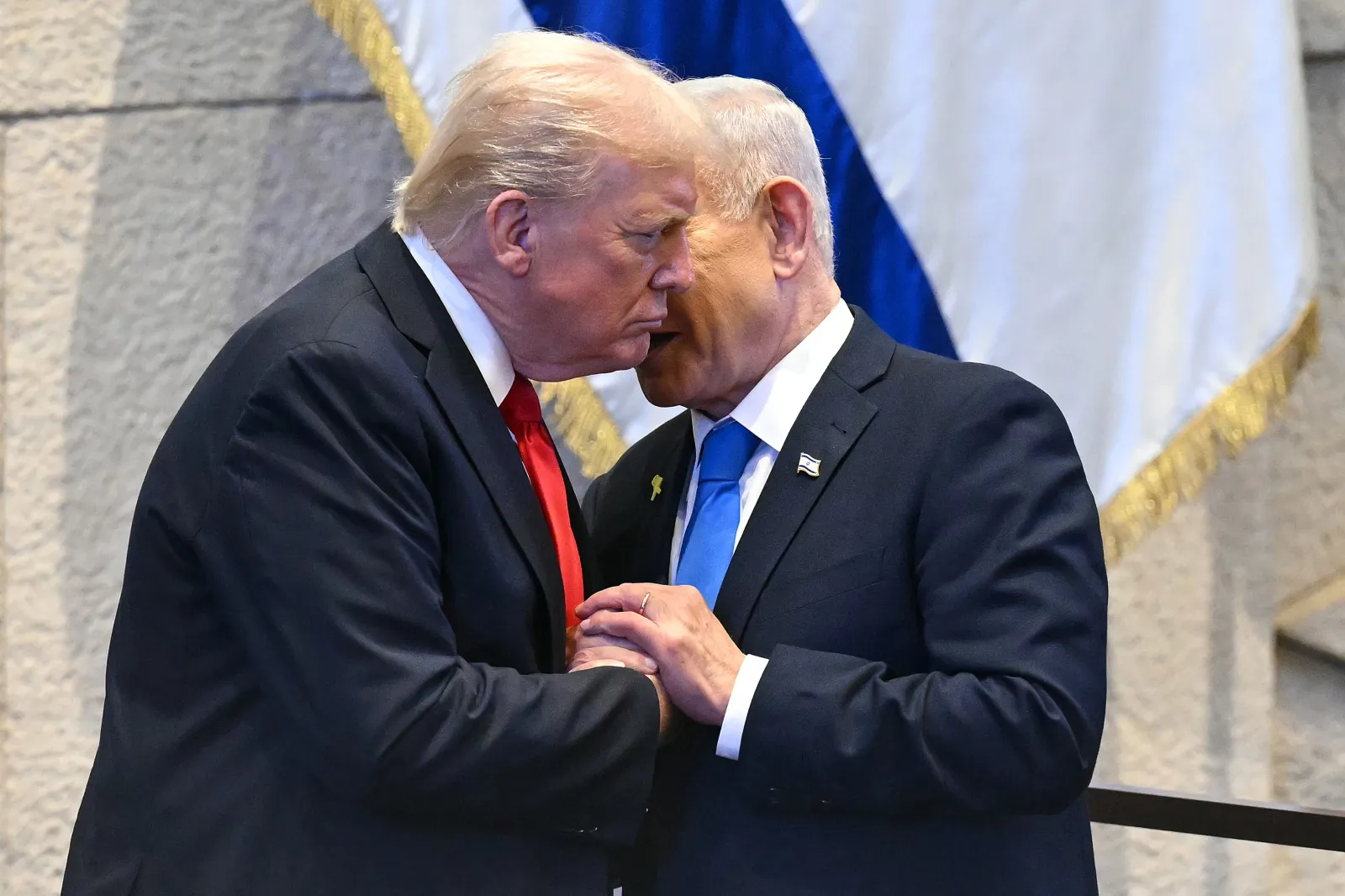 President Donald Trump speaks with Israeli Prime Minister Benjamin Netanyahu at the Knesset, Israel's parliament, on October 13, 2025, in Jerusalem.