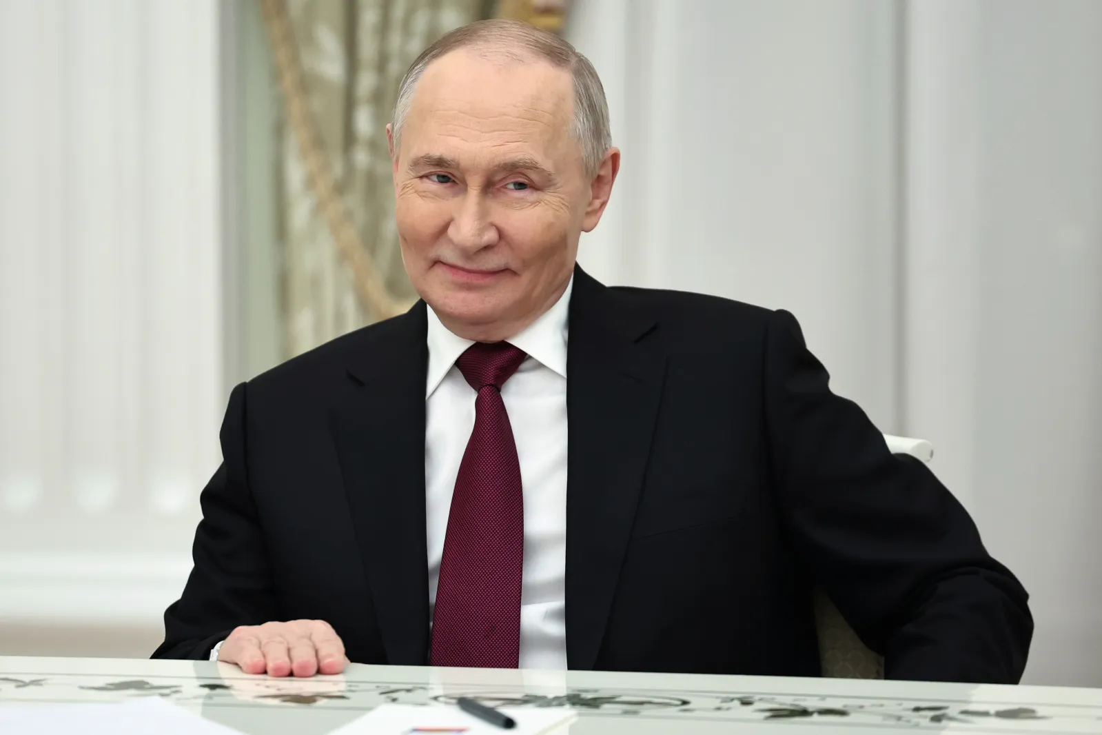 Russian President Vladimir Putin smiles during the talks with U.S. special envoy Steve Witkoff and Jared Kushner, U.S. President Donald Trump's son-in-law, at t