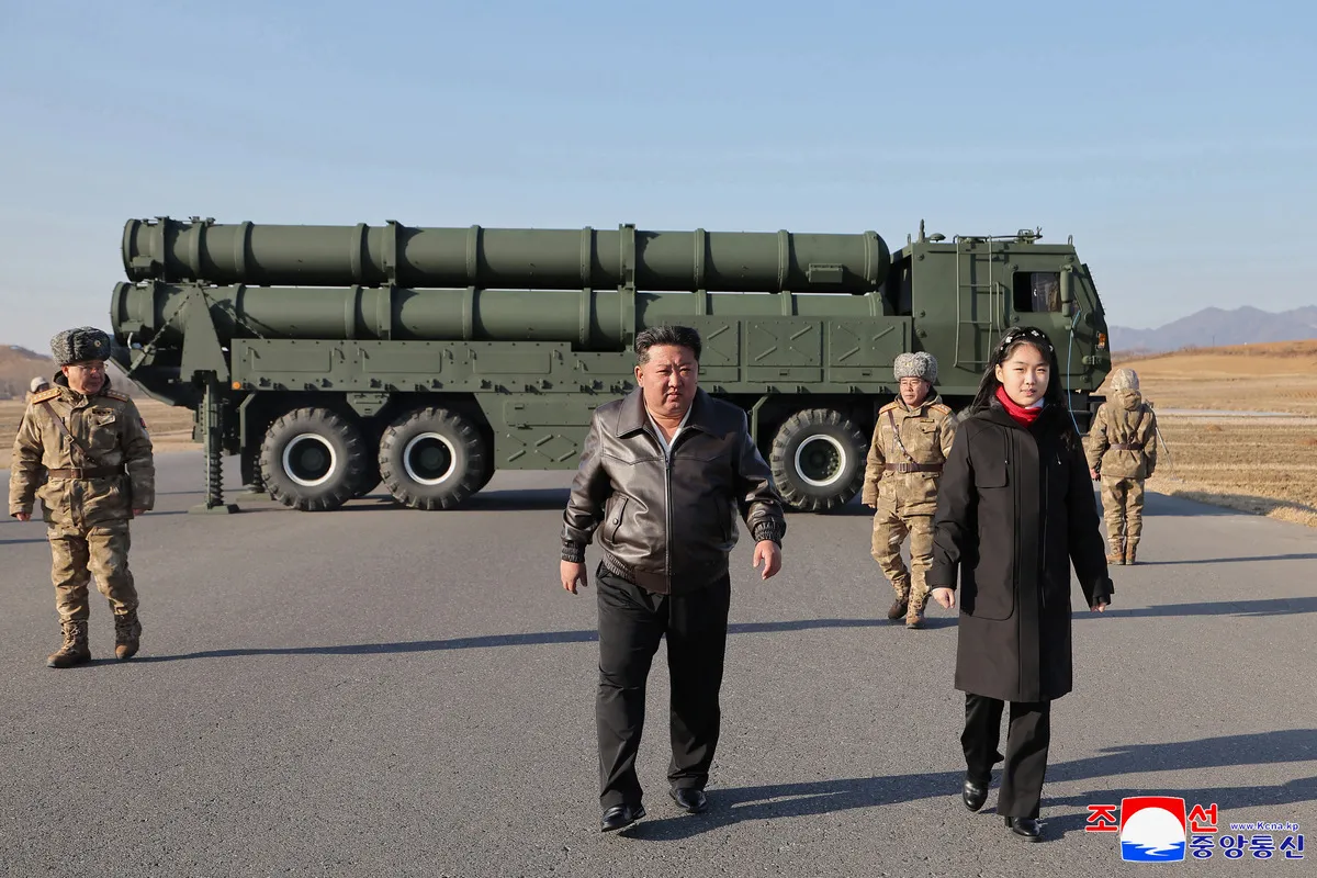 In this photo provided by the North Korean government, North Korean leader Kim Jong Un, with his daughter, believed to be named Kim Ju Ae, attends the test-firing of ballistic missiles at an undisclosed location in North Korea, on January 27, 2026.