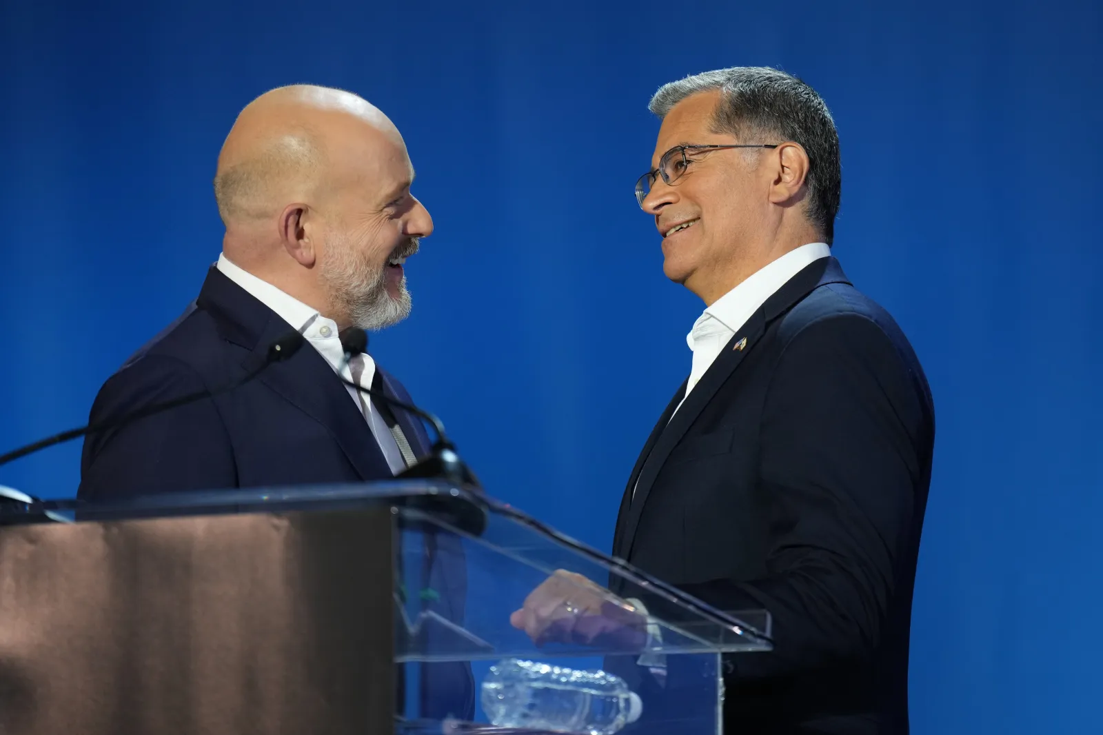 Steve Hilton, left, and Xavier Becerra speak during a break in a California gubernatorial debate hosted by CBS LA at Pomona College in Claremont, Calif., Tuesday, April 28, 2026. (AP Photo/Jae C. Hong)