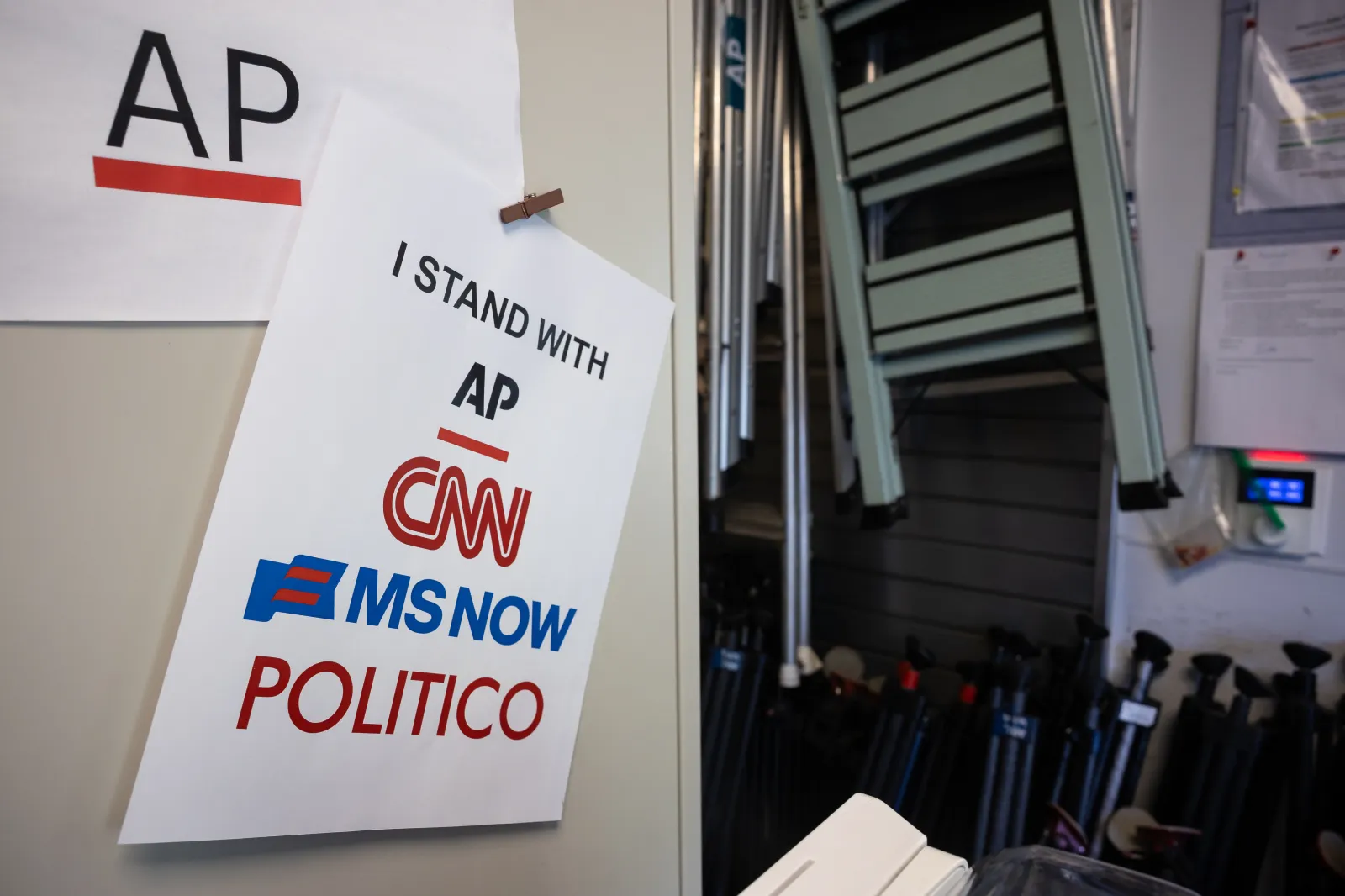 Signs express solidarity with news outlets that have experienced bans from the White House grounds and/or White House events in the Lower Press area of the White House on Sept. 25, 2026. (Francis Chung/POLITICO via AP Images)
