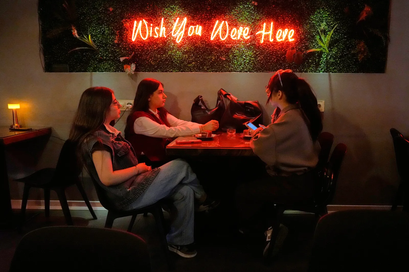 Women sit at a cafe in downtown Tehran on October 6, 2026.