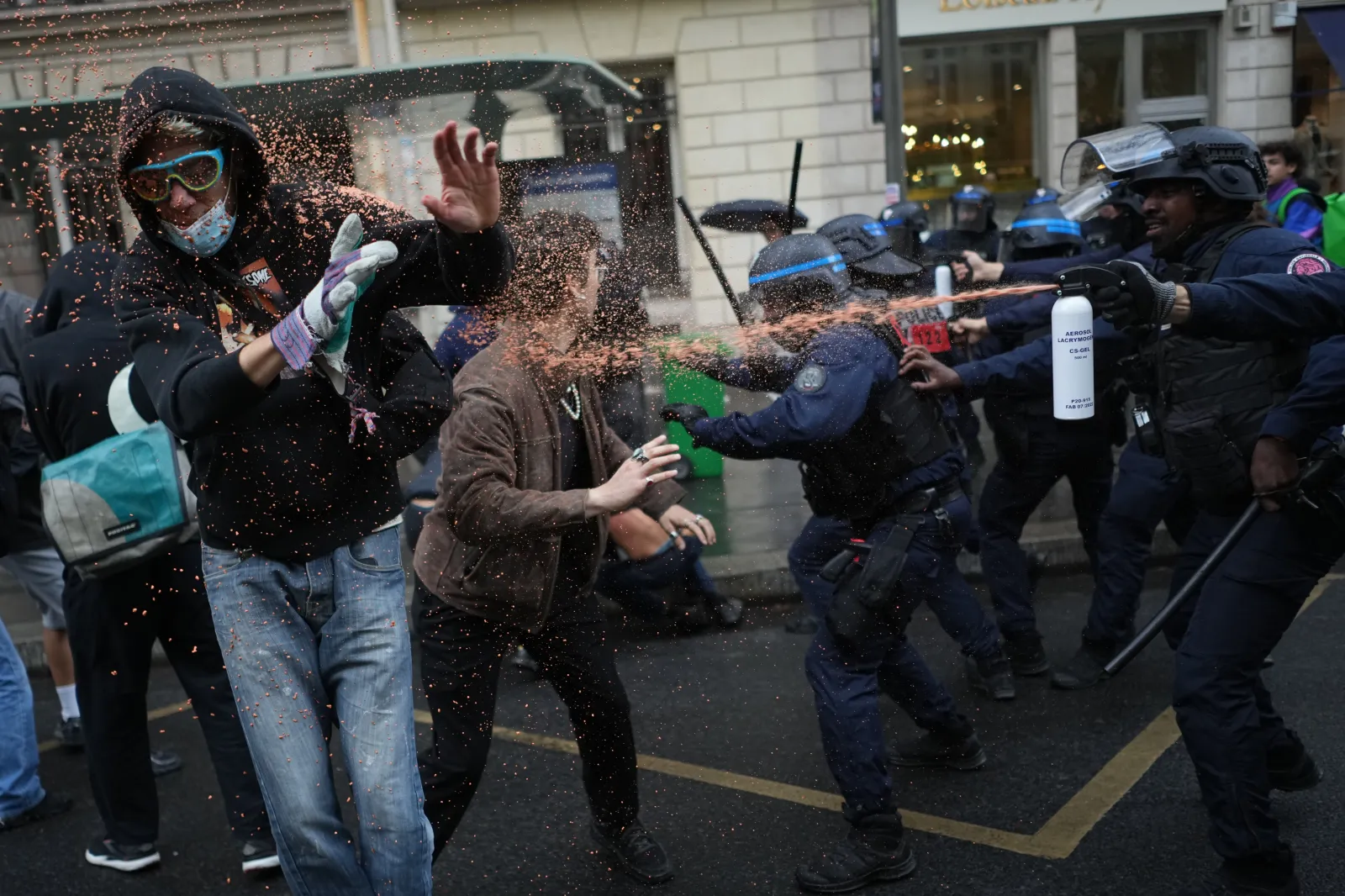 Police officers spray students with pepper spray near Sciences Po university, in Paris, on October 7.