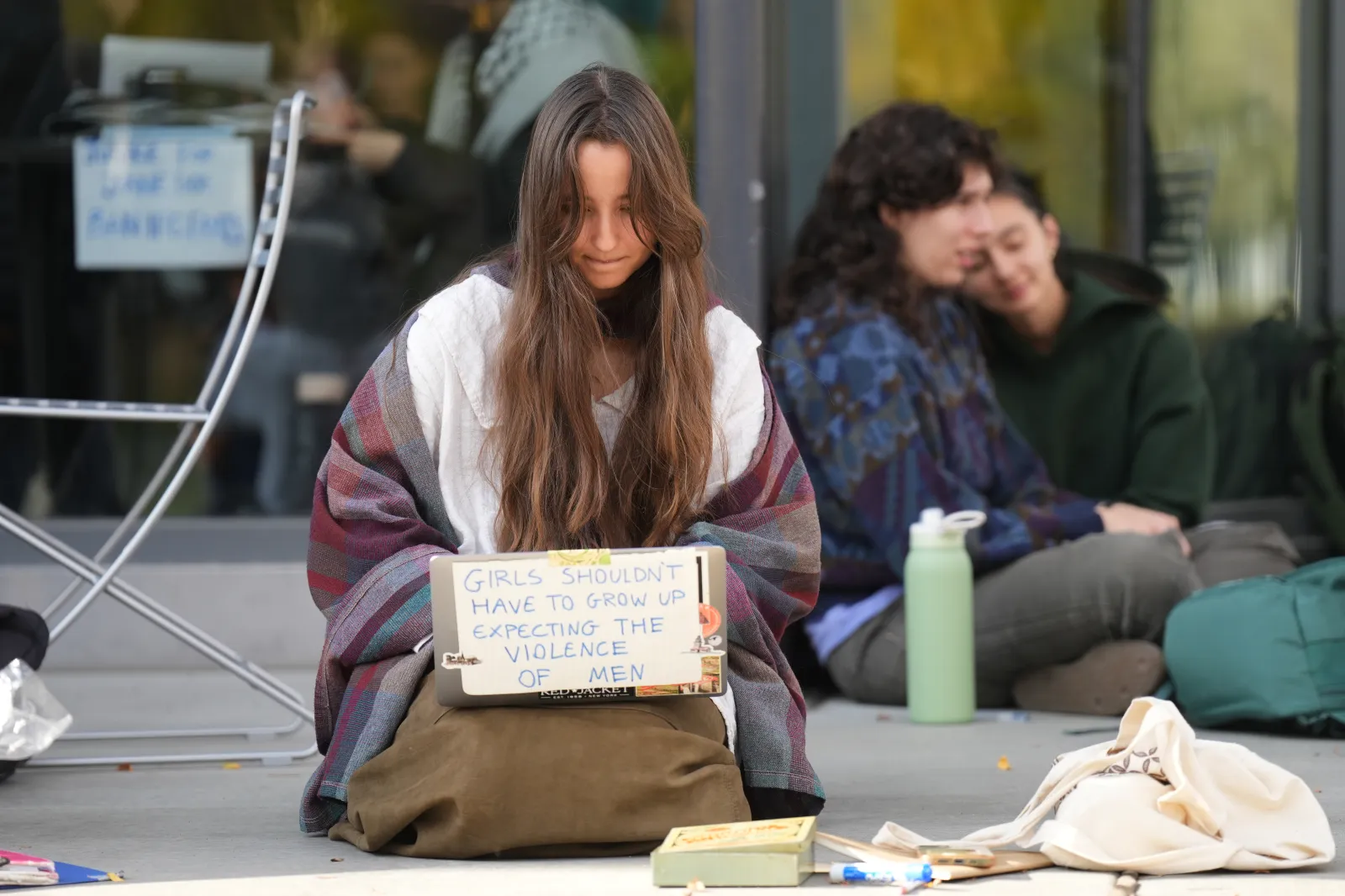 Student Isabel Breslin works on her laptop during a sit-in protest at Cornell University on October 7, 2026, in Ithaca, New York.