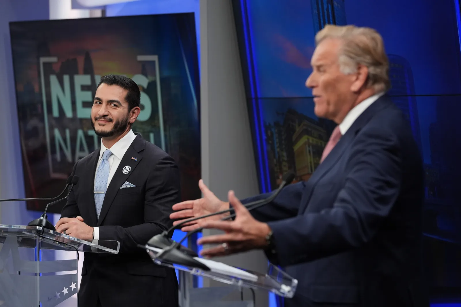 Republican U.S. Senate nominee Mike Rogers, right, speaks during a televised debate with Democratic nominee Abdul El-Sayed, at WOOD-TV, on October 8, 2026, in Grand Rapids, Michigan (AP Photo/Paul Sancya, Pool)