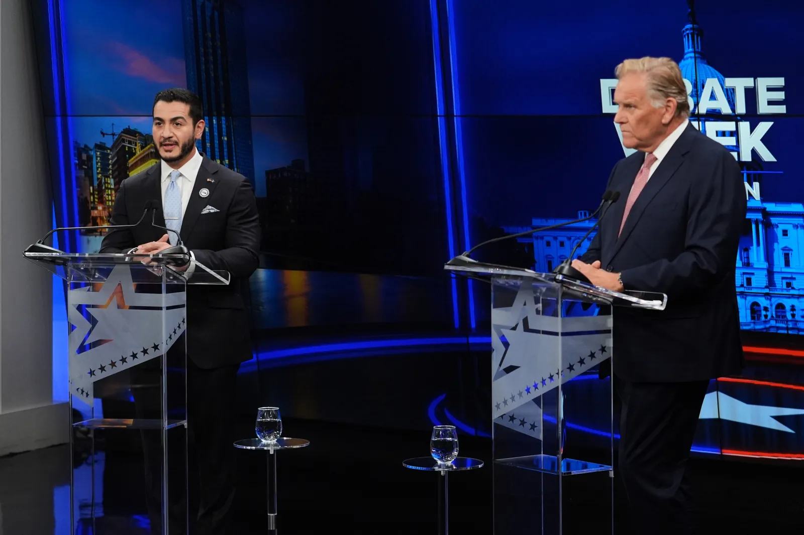 Abdul El-Sayed, left, faces off against Mike Rogers during a televised debate on October 8 in Grand Rapids, Michigan. (AP Photo/Paul Sancya, Pool)