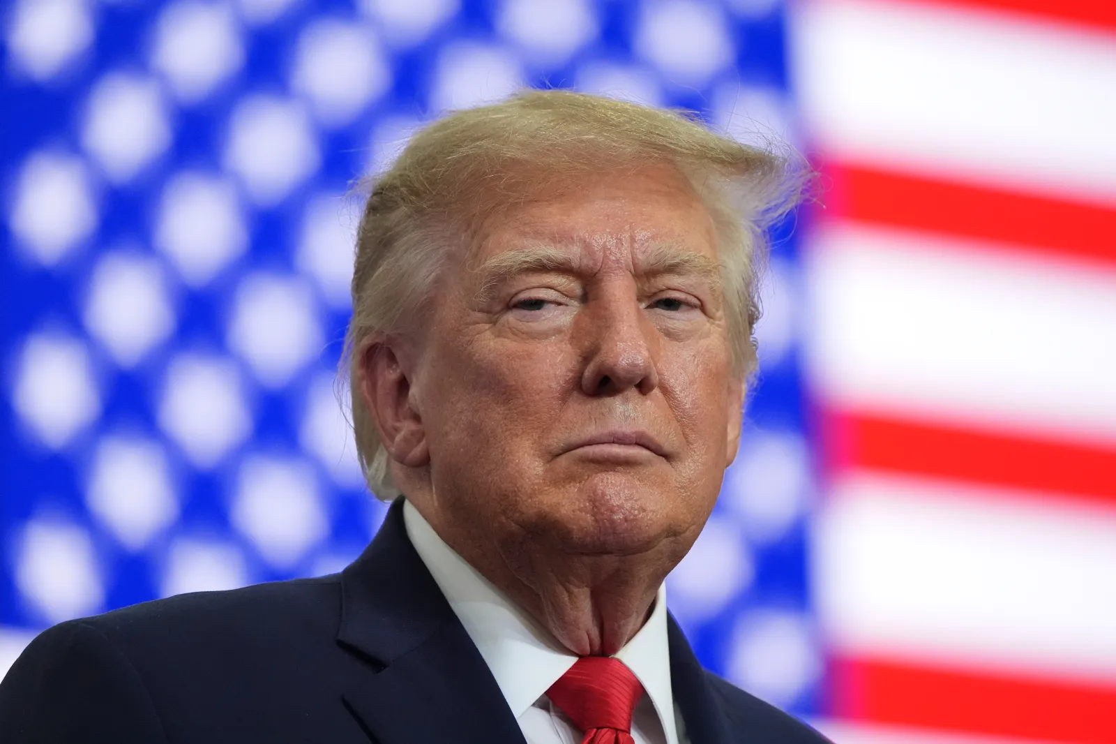 President Donald Trump listens at a campaign rally at the Curtis D. Menard Memorial Sports Center, Tuesday, Oct. 13, 2026, in Wasilla, Alaska.