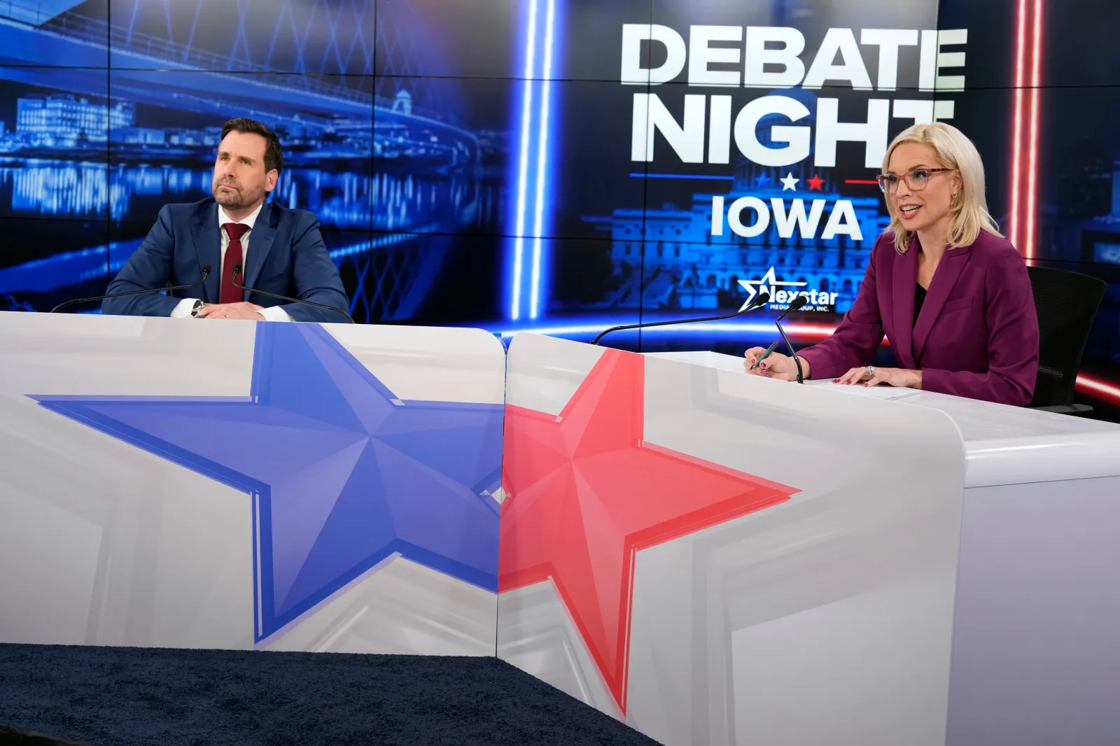 Republican nominee for U.S. Senate Ashley Hinson, right, speaks during a televised debate with Democratic nominee for U.S. Senate Josh Turek at WHO 13, Tuesday, Oct. 13, 2026, in Des Moines, Iowa. (AP Photo/Charlie Neibergall)
