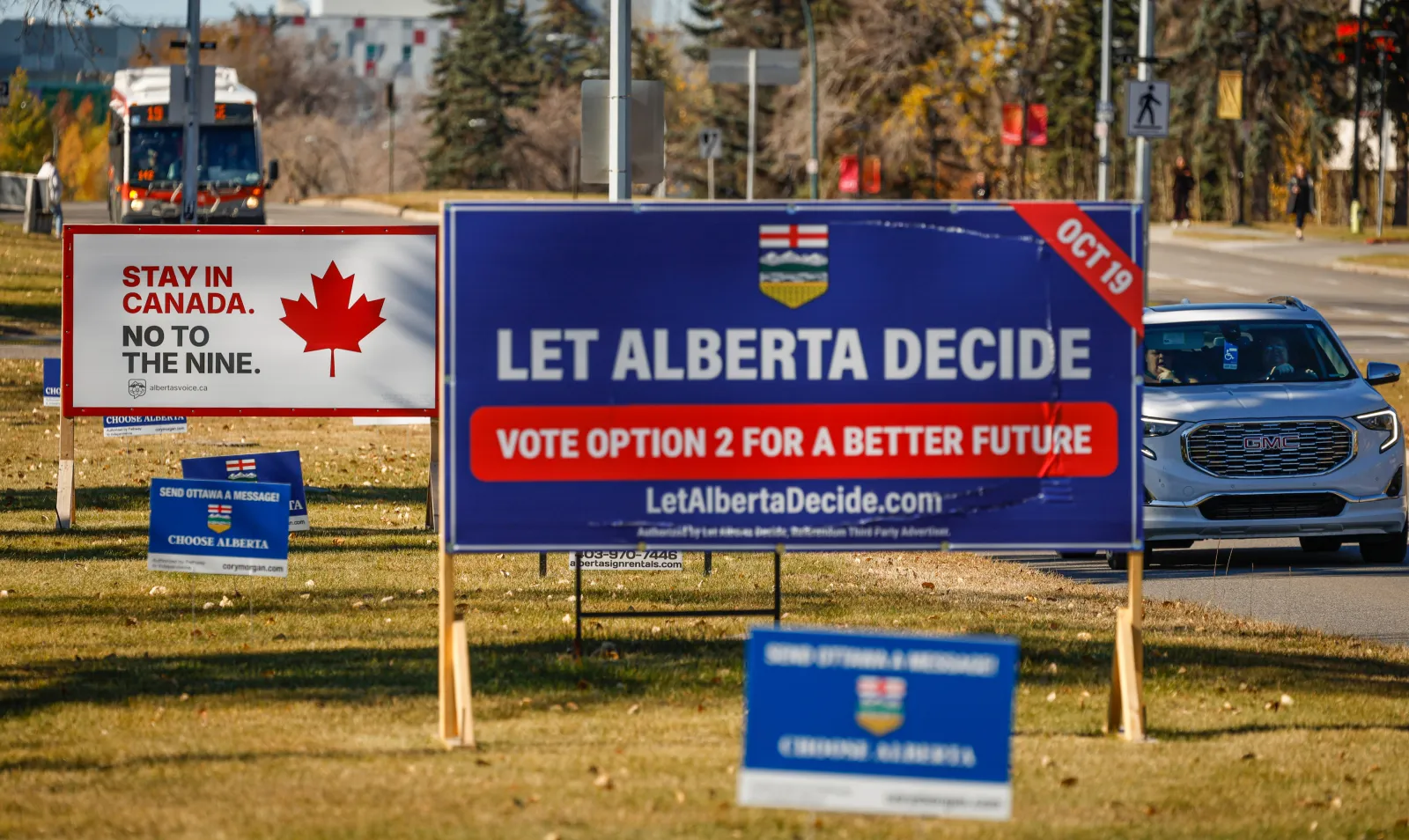 Competing referendum signs line a boulevard in Calgary, Canada, on October 15.
