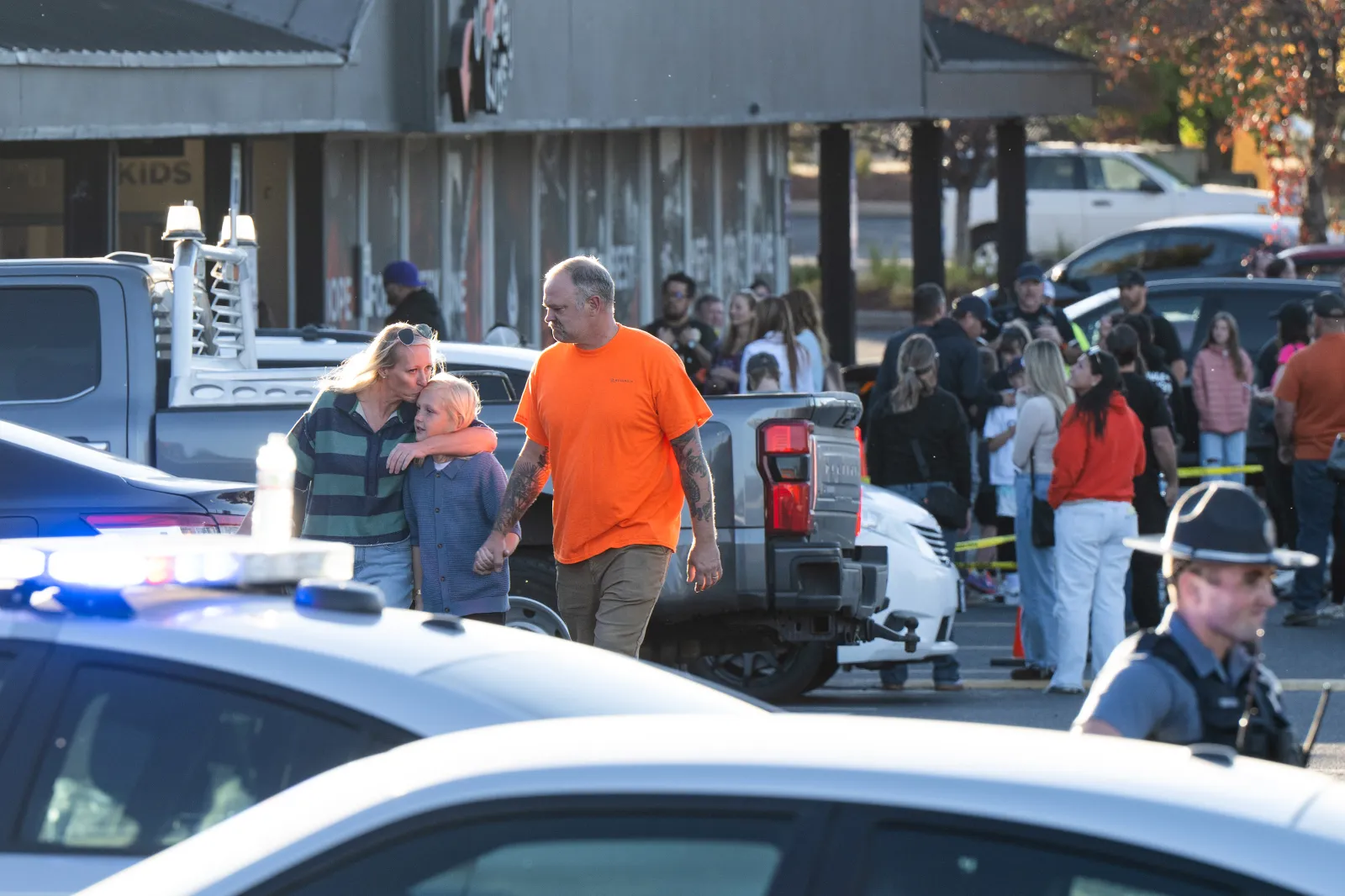 People leave a family meeting area following a shooting at Silver Rail Elementary School on October 15, 2026, in Bend, Oregon.