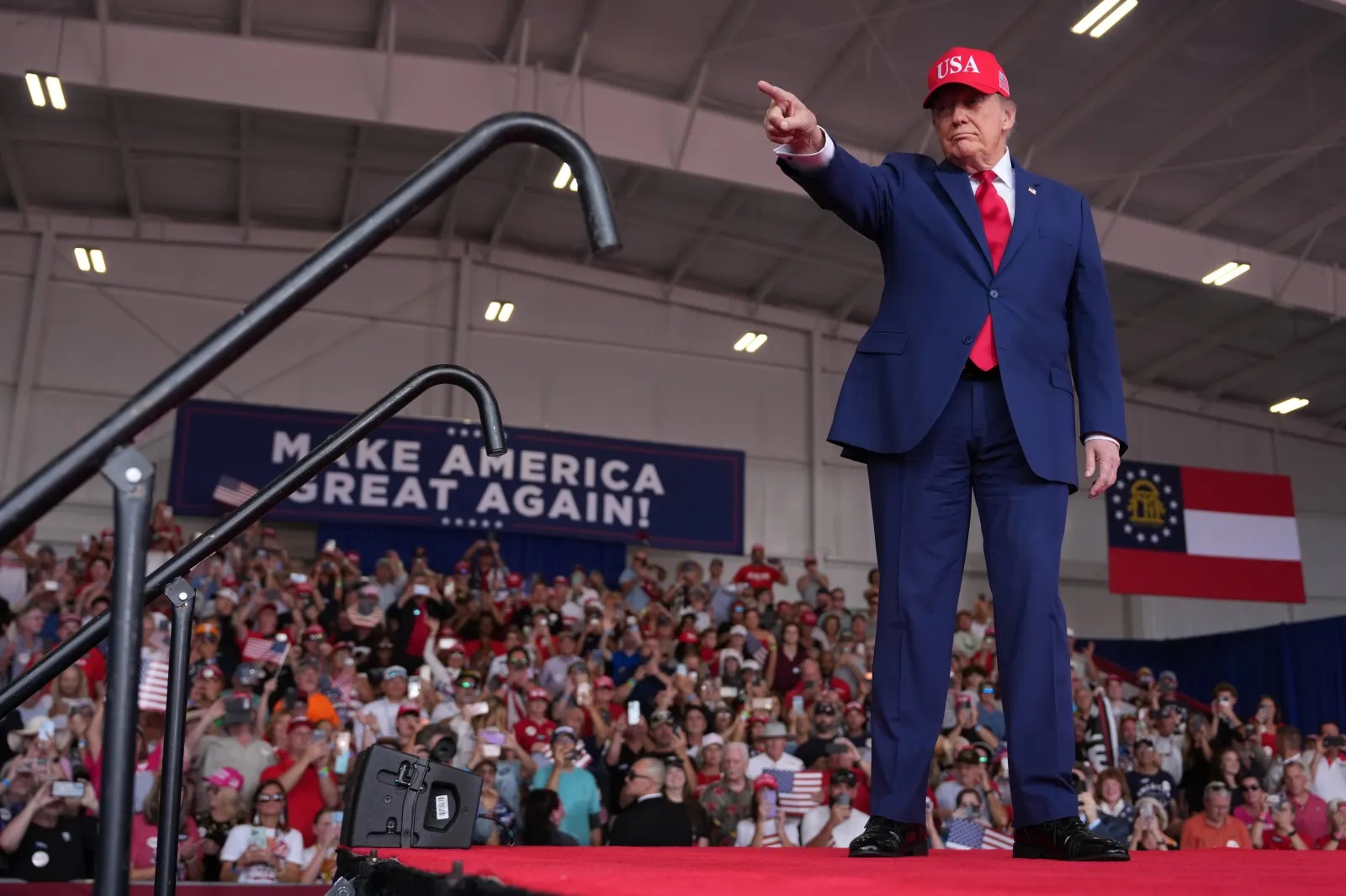 President Donald Trump arrives at a campaign rally at Dalton Municipal Airport on Friday in Dalton, Georgia.