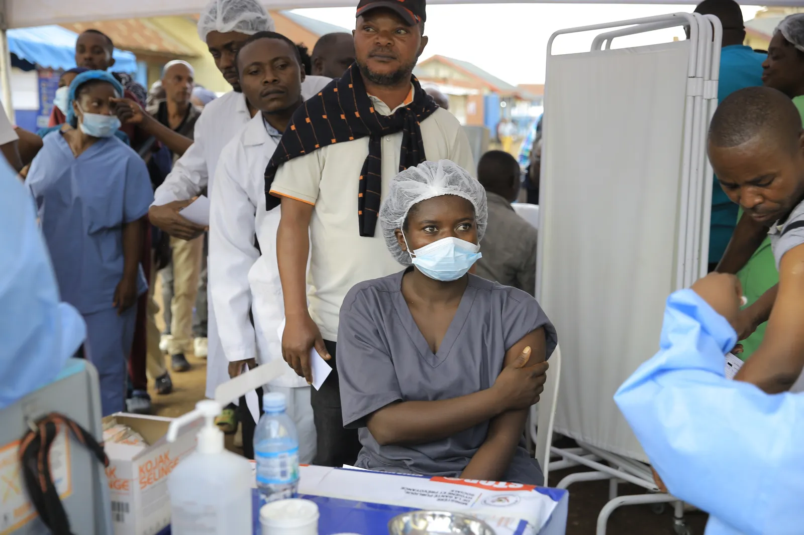 Healthcare workers line up to receive a dose of the Ervebo vaccine against the Ebola virus in Beni, North Kivu province, Congo, on October 16, 2026. (AP Photo/Sebastien Kitsa Musayi)