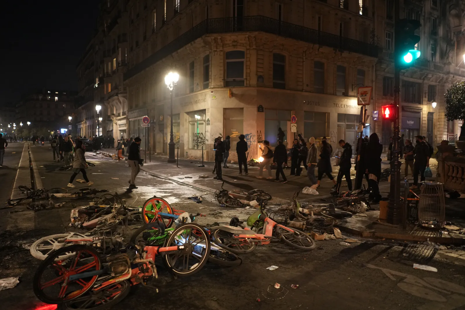 People walk past bicycles lying in the street after a demonstration against rising living costs, joining students' grievances, in Paris, October 17.