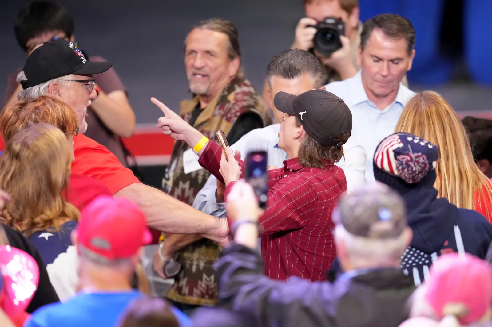 A protester shouts as President Donald Trump speaks during a campaign rally at Truist Arena on October 17 in Highland Heights, Kentucky. (AP Photo/Jeff Dean)