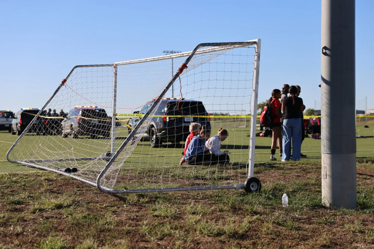 This image provided by KAKE shows police on the scene where a person drove a vehicle through a soccer field during a game in Wichita, Kansas, on October 17. (Wyatt Glosson/KAKE via AP)
