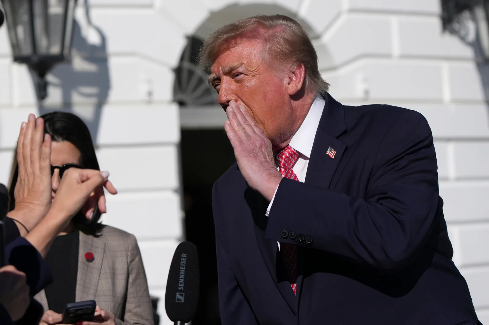 President Donald Trump speaks with reporters before departing on Marine One from the South Lawn of the White House, October 19, in Washington.