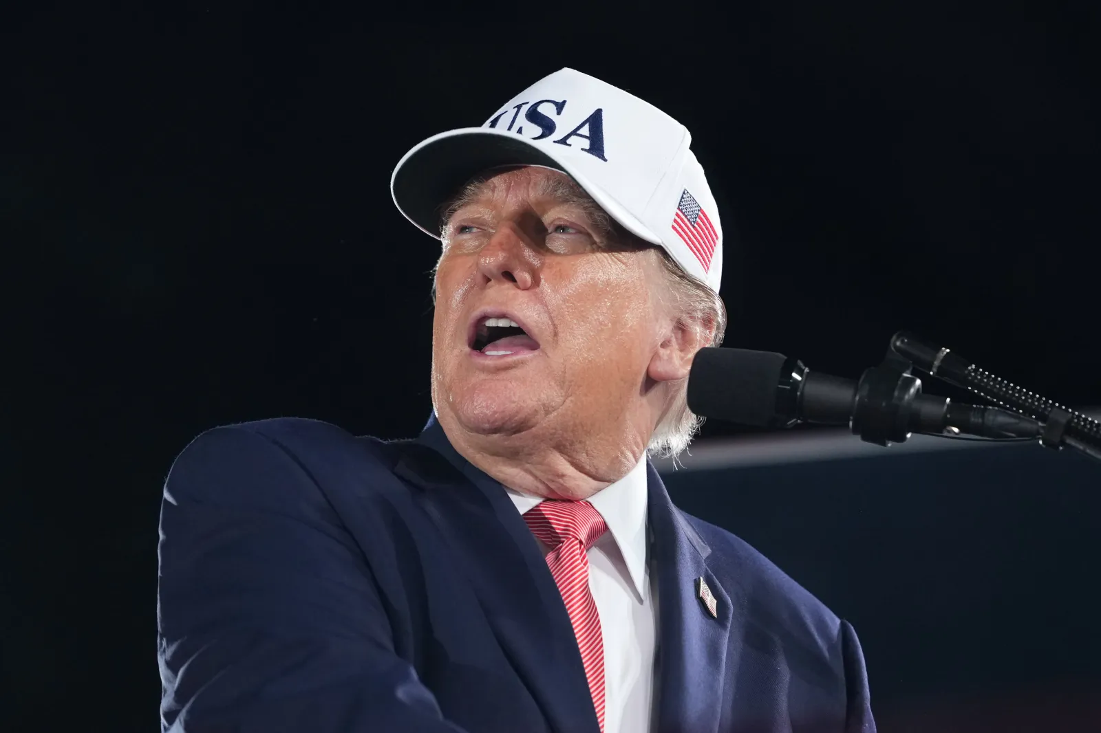 President Donald Trump watches as a video plays at a campaign rally at Pitt–Greenville Airport in Greenville, North Carolina, on October 20, 2026.