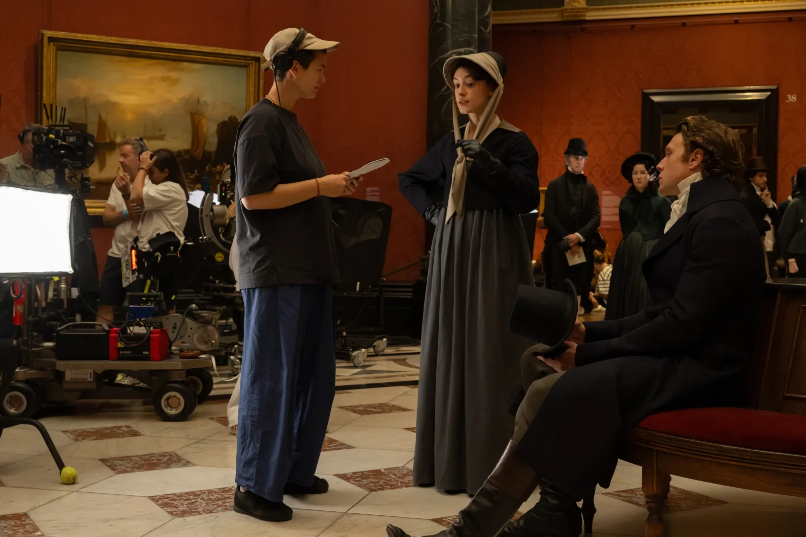 Director Georgia Oakley with actors Daisy Edgar-Jones and George MacKay on the set of their film Sense and Sensibility, a Focus Features release.