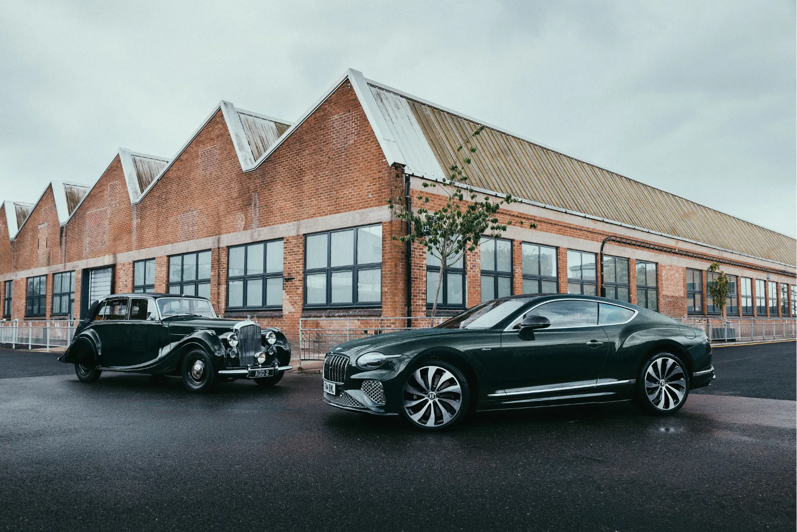 1946 Bentley Mark VI and the Continental GT Azure parked alongside each other in Crewe, England.