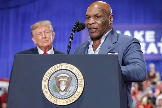 Former professional boxer Mike Tyson (R) speaks on stage during an election rally at the Oncenter on October 09, 2026 in Syracuse, New York.