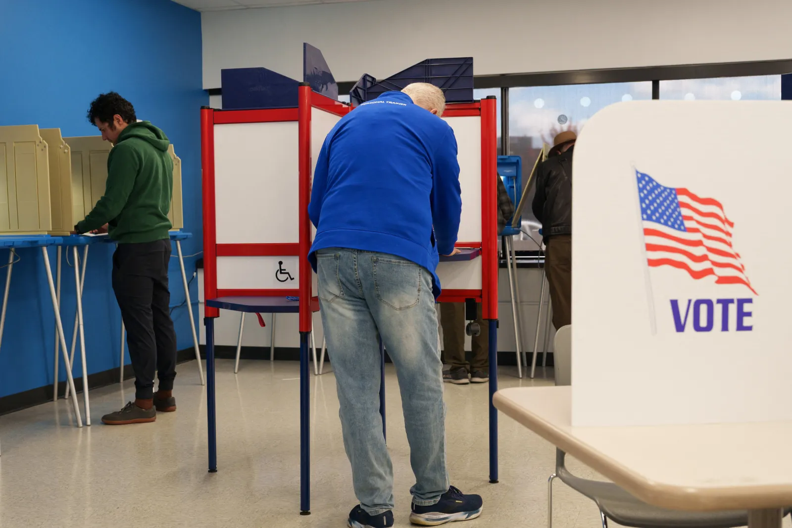 People fill their ballots during the first day of early voting for the midterm elections in Minneapolis, Minnesota, on October 16, 2026