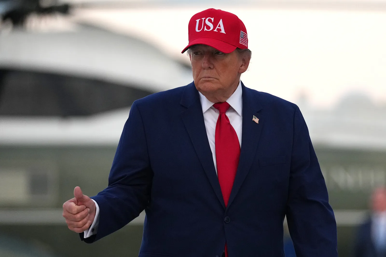 Donald Trump walks from Marine One to board Air Force One as he departs Dobbins Air Reserve Base on October 16, 2026 in Marietta, Georgia.