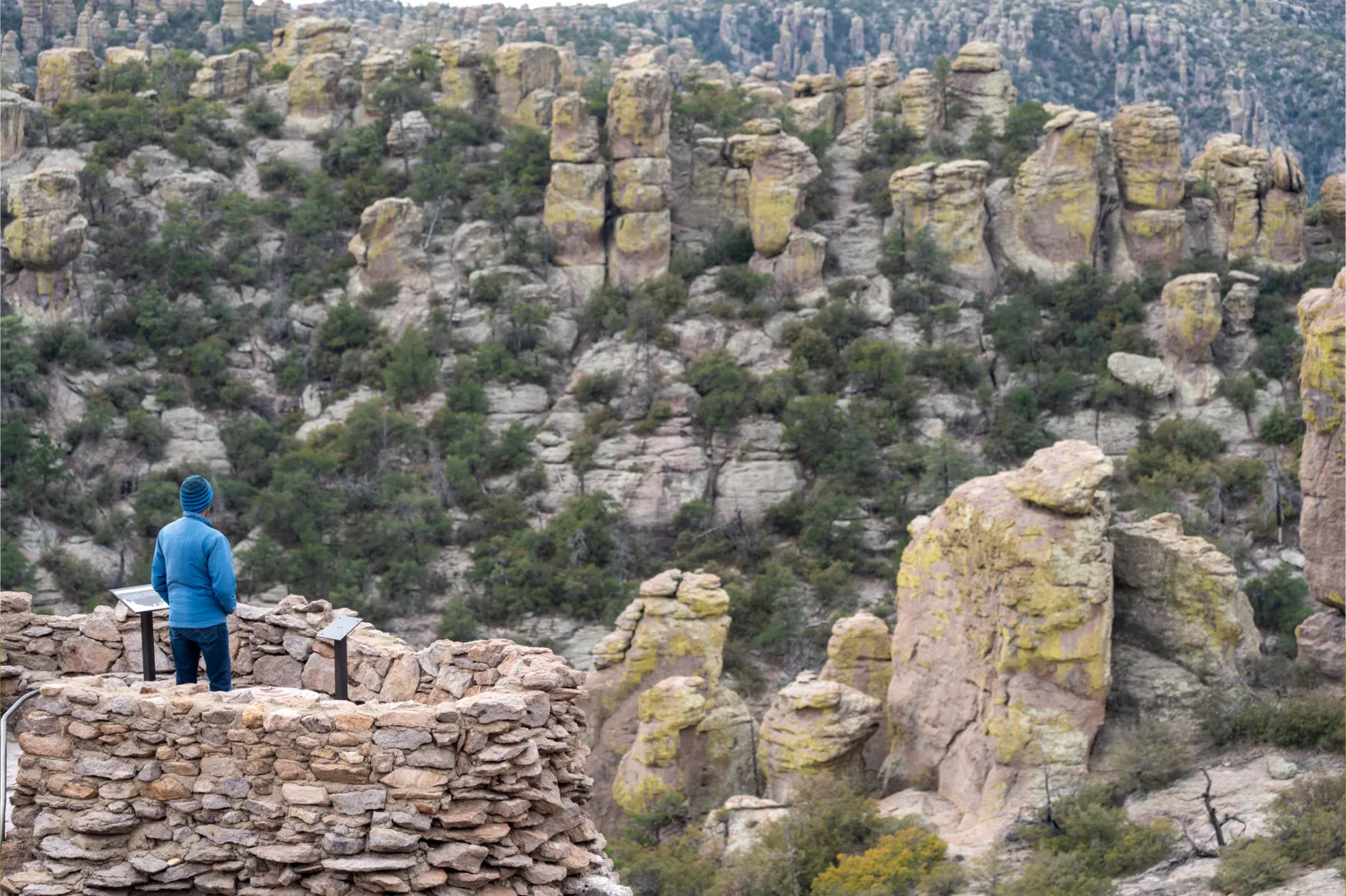 A hiker enjoys the view at Chiricahua National Monument in Arizona in 2023