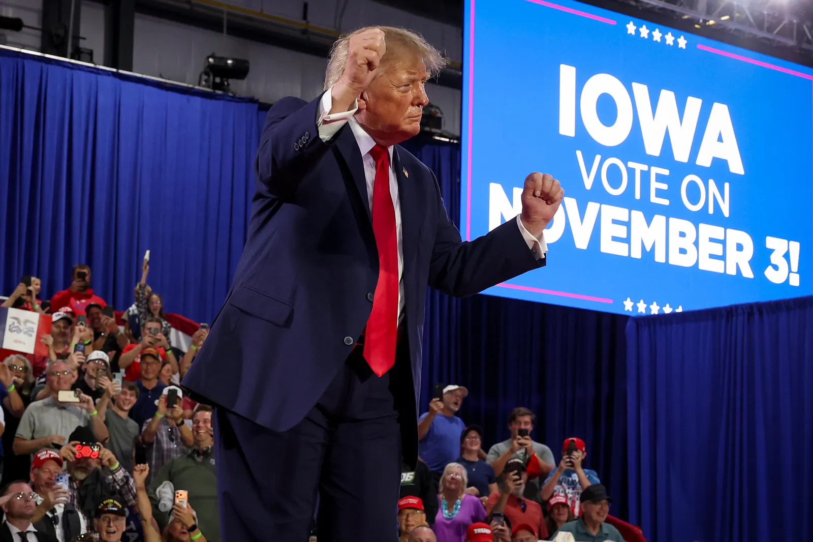 President Donald Trump dances as he departs after speaking at a rally at Sioux Gateway Airport on October 22, 2026 in Sioux City, Iowa.