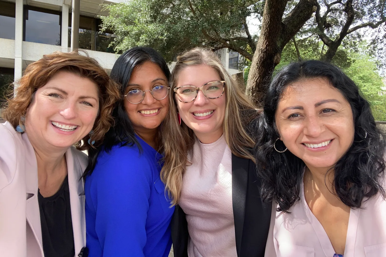 Abigail Seymour (L) poses with her Camino Law colleagues outside.