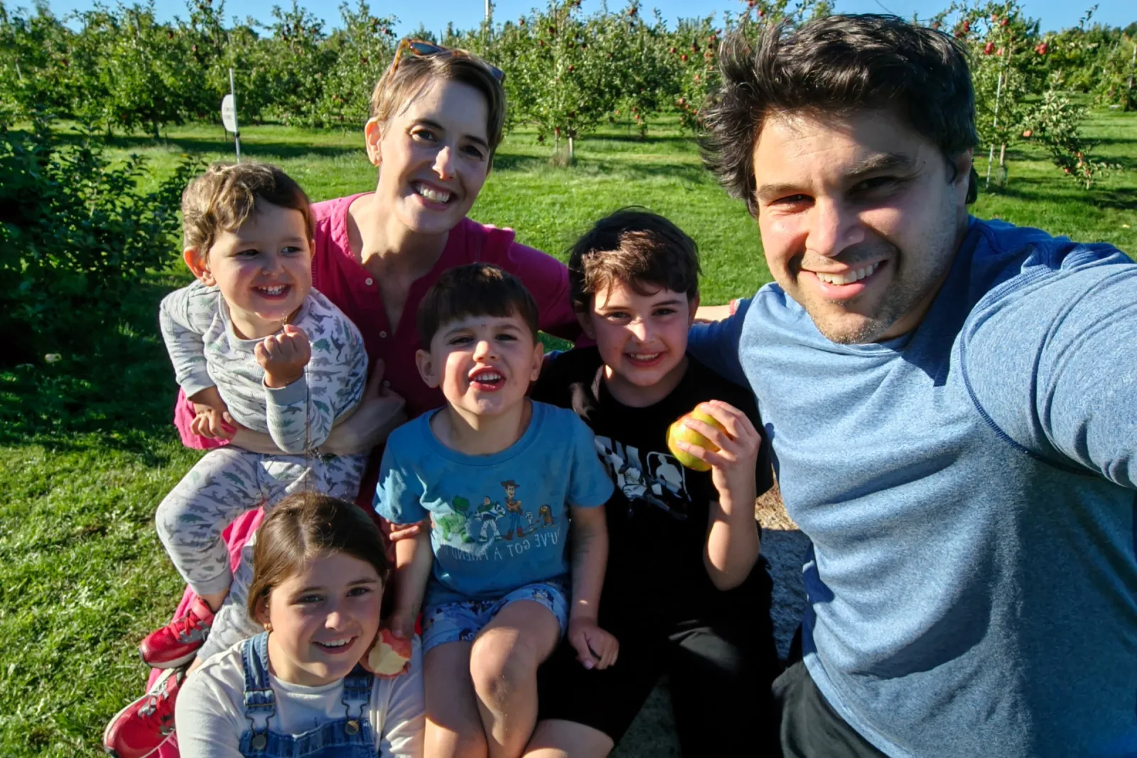 Julia Sinnott poses outside with her husband and their four children.