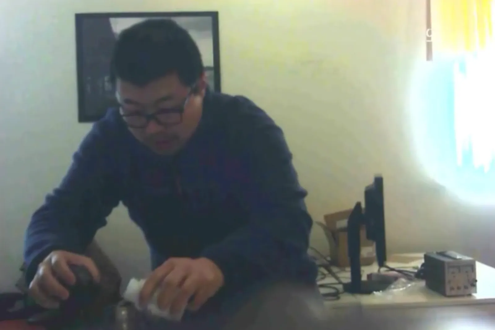 A screenshot shows David Xu pouring a substance into co-worker Rong Yuan's water bottle.