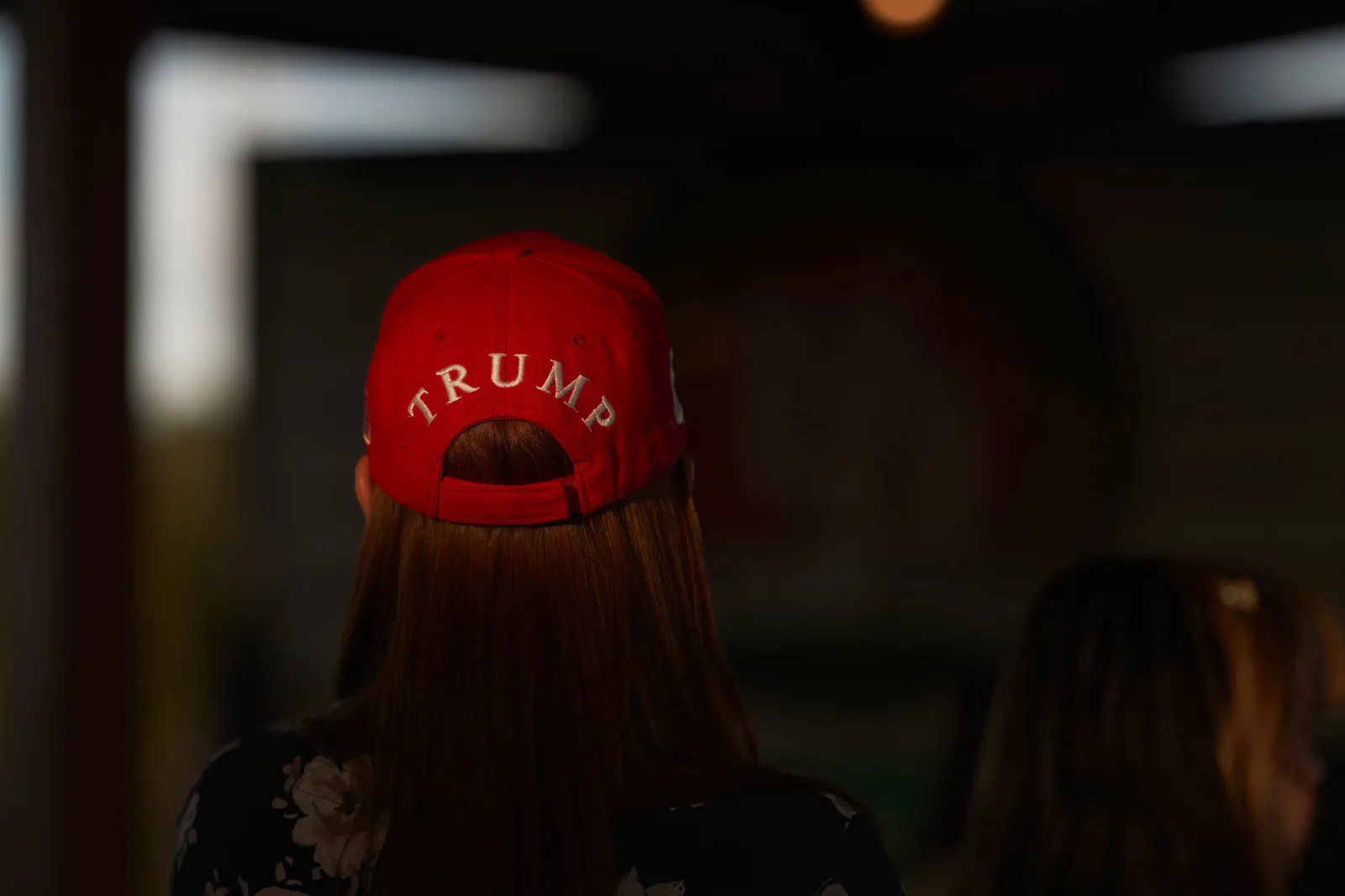 A woman with a Trump hat attends a campaign event for Monica De La Cruz, Republican candidate for Congress, and Representative Mayra Flores (R-TX), who is running for reelection, at the University Drafthouse in McAllen, Texas, on October 10, 2022.