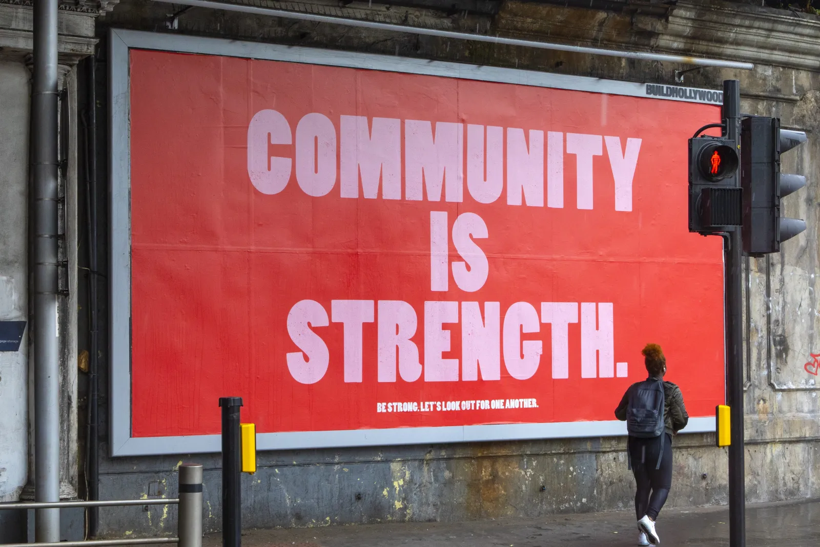 File photo: A poster with the message Community is Strength on display near London Bridge station in London, UK.