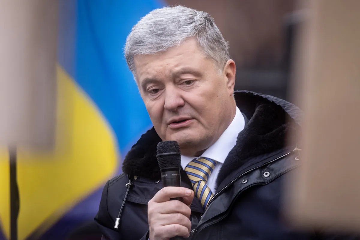 Ukraine's former President Petro Poroshenko speaks to supporters and media outside the Kyiv District Court of Appeal on January 28, 2022.