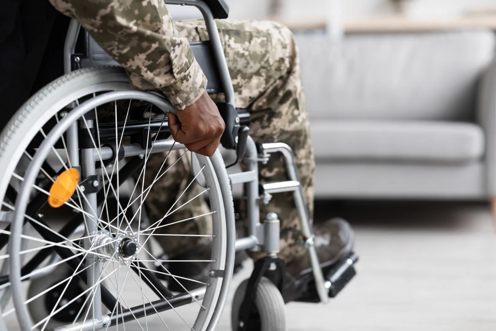 Stock image: a veteran in uniform uses a wheelchair.