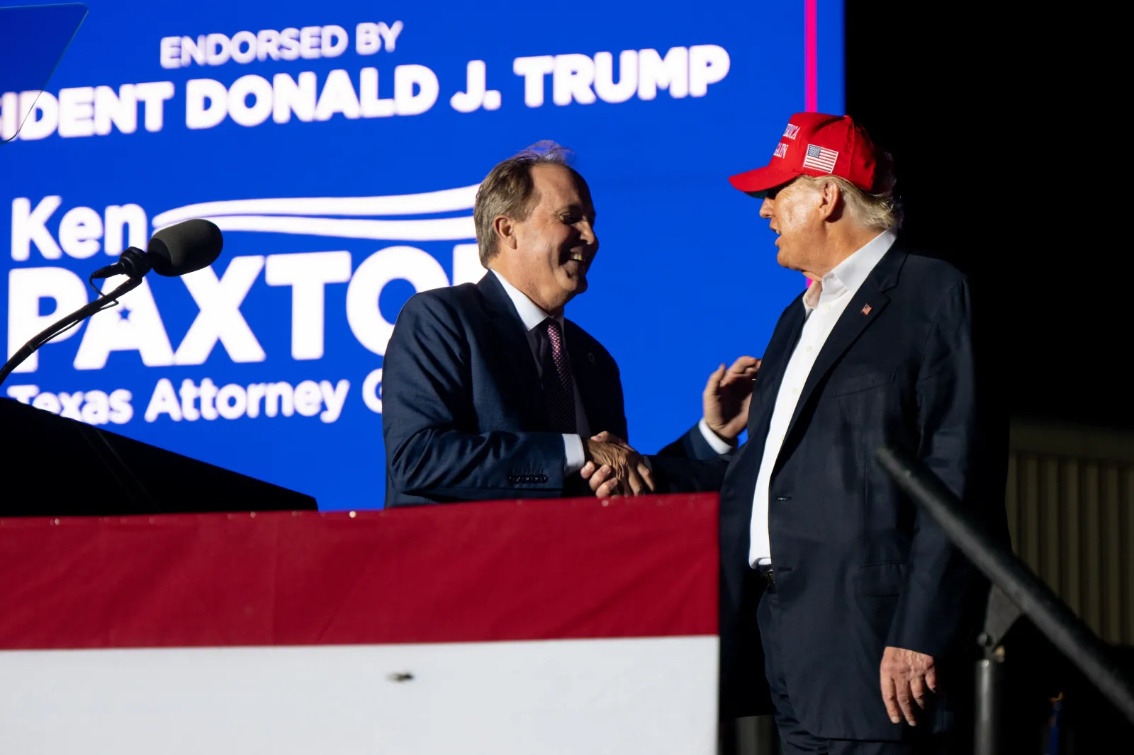 Texas Attorney General Ken Paxton greets then-former President Donald Trump at a "Save America" rally on October 22, 2022, in Robstown, Texas. (Photo by Brandon Bell/Getty Images)