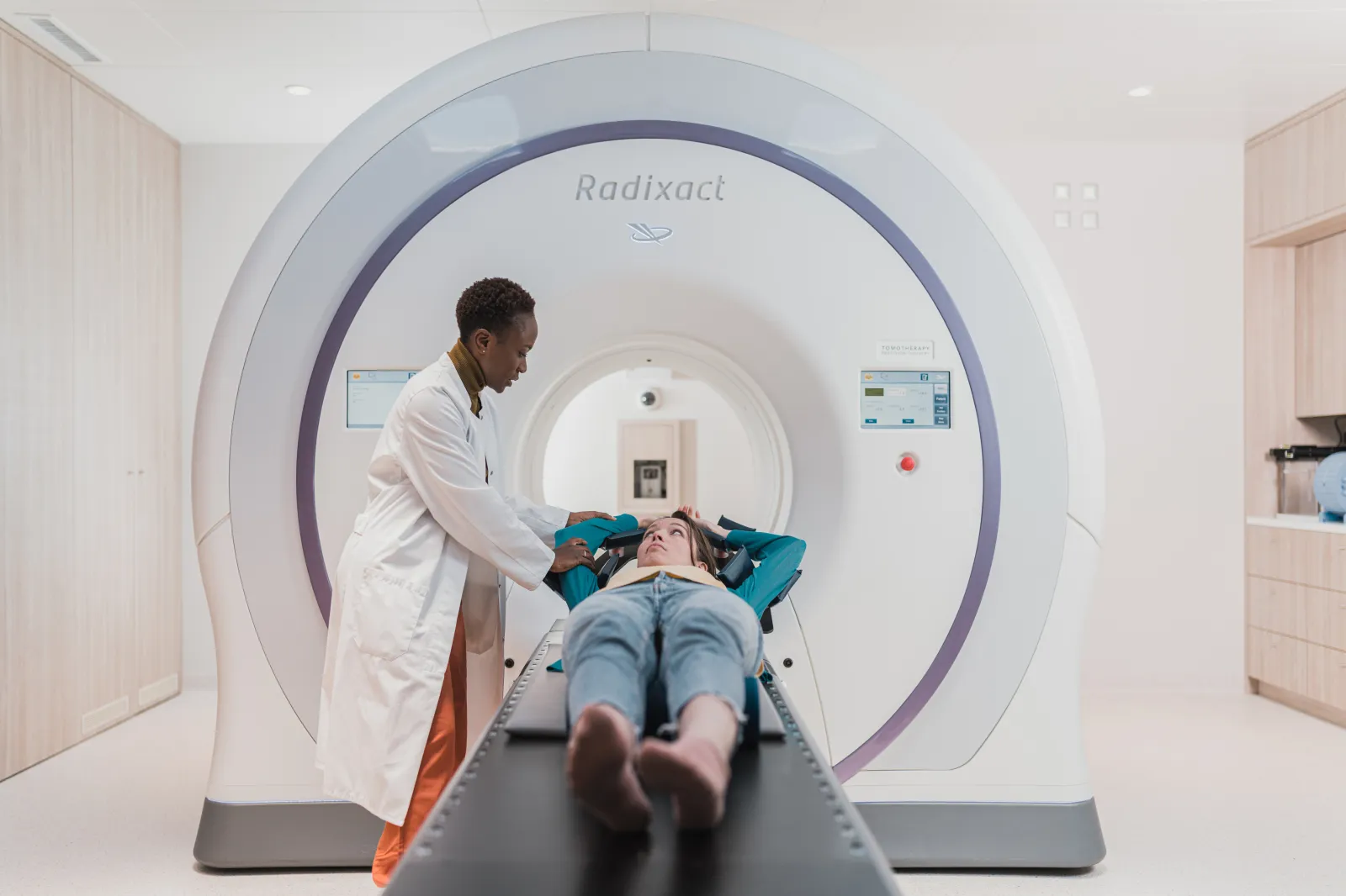 Accuray Radixact machine with patient being positioned and accompanied by therapist on August 26-27 in Geneva, Swiss Confederation