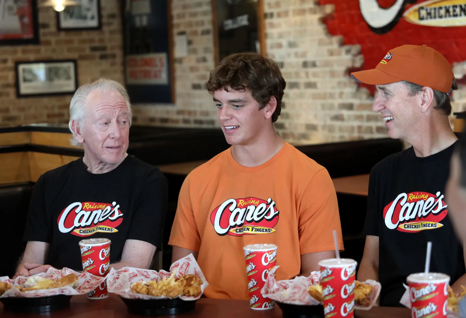 Archie Manning, Arch Manning and Cooper Manning work a Pre-Manning P